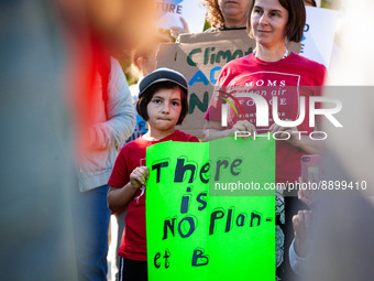 A member of Mom’s Clean Air Force and her child attend a Fridays for Future rally, part of a worldwide climate strike.  The global action ca...