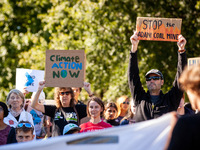 People attend a rally for a worldwide Fridays for Future climate strike.  The global action calls for climate justice and reparations for co...