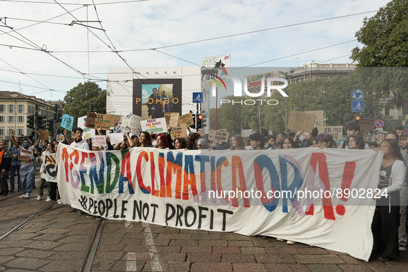 Students from the Friday for Future movement at the head of the event display a banner calling for more political attention to the climate a...