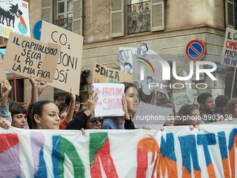 Posters with environmental slogans displayed by students at the Global Climate Strike. 
Milan, 23 September 2022 (