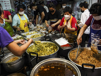 
Food vendors sell vegetables and vegitarian foods of the vegetarian festival, in the Chinatown area of Bangkok, Thailand, 25 September 2022...