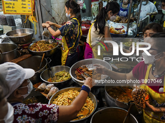 
Food vendors sell vegetables and vegitarian foods of the vegetarian festival, in the Chinatown area of Bangkok, Thailand, 25 September 2022...