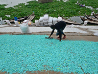 Worker recycled plastic chips drying under the sun on the bank of the Buriganga River in Dhaka, Bangladesh, on September 25, 2022. World Riv...