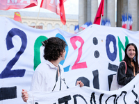 Activists behind a banner during the climate march organized by Youth for Climate, in Paris, France, on September 25, 2022. (