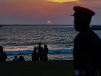 People are watching the sunset at Galle Face. September 25, 2022 Colombo, Sri Lanka (