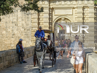 People visiting the historical city on the horse cart are seen in Mdina, Malta on 23 September 2022 Mdina (former Melite) is a fortified cit...