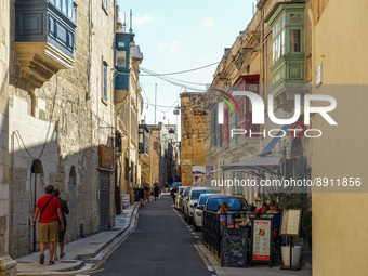 People walking by the old town street are seen in Rabat , Malta on 23 September 2022  (
