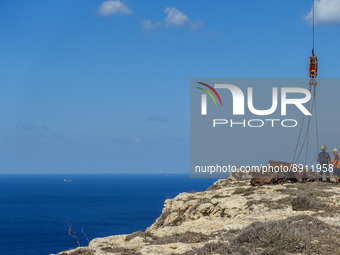 Removal of car wrecks from Dingli Cliffs by the Firemans and Civil Protection Unit is seen in Dingli, Malta on 24 September 2022 Dingli Clif...