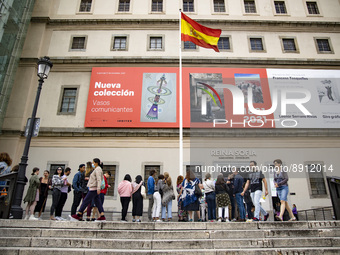 People queue in front of the Museum Reina Sofia in Madrid, Spain on September 25, 2022. (