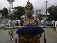 People of Phetchabun, dressed in ancient costumes, march together to parade the Buddha image of Phra Phuttha Maha Thammaracha around the cit...