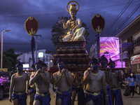 People of Phetchabun, dressed in ancient costumes, march together to parade the Buddha image of Phra Phuttha Maha Thammaracha around the cit...