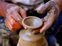 Indian potter making earthen lamps for the Hindu Festival Celebrations in Ajmer, India on 26 september 2022. (