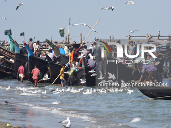 
Fishermen are seen unloading fishes from boat near fishing village Naziratek in Cox's Bazar on December 8, 2018. Naziratek on the beach at...