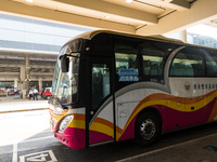  A government hired bus ready to take passengers found positive with COVID to the Penny Bay quarantine center awaits outside of the Hong Kon...