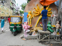 Artisan is seen giving final touches to an idol of Goddess Durga , ahead of Durga puja festival in Kolkata , India , on 26 September 2022 .M...