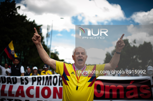 A demonstrator participates during the first antigovernment protest against left-wing president Gustavo Petro and his initiative on a tax re...