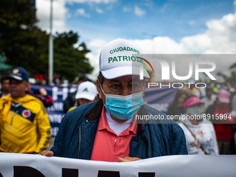 A demonstrator wears a cap that reads 'Patriotic Citizen' during the first antigovernment protest against left-wing president Gustavo Petro...