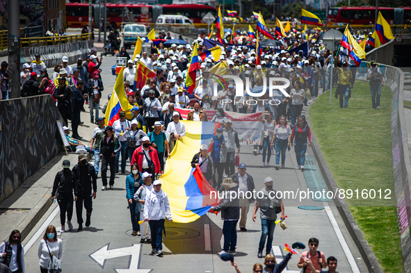 Demonstrators take the streets with Colombian flags during the first antigovernment protest against left-wing president Gustavo Petro and hi...