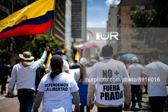 Demosntrators wear shirts that read 'We defen freedom' and 'No more corruption, out with Alfonso Prada' during the first antigovernment prot...