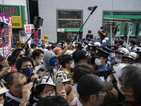Protesters against the state funeral confront police blocking the road to the funeral’s venue in Tokyo, Japan, 27 Sep. (