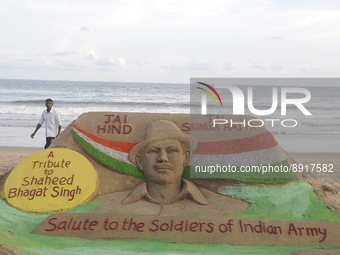 A sand sculpture of Saheed Bhagat Singh is seen at the Bay of Bengal Sea's Puri beach on his birth anniversary at Puri, 65 km away from the...