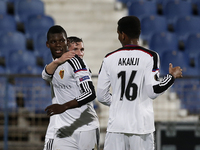 Basel's forward Breel-Donald Embolo  (L) celebrates his goal with his tea mates during the UEFA Europa League  football match between CF Bel...