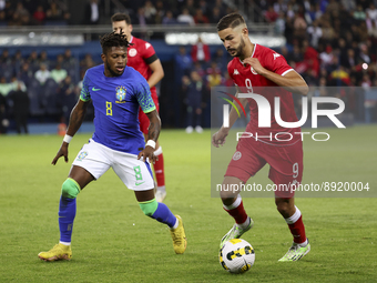 Mortadha Ben Ouanes of Tunisia, Frederico Rodrigues aka Fred of Brazil (left) during the International friendly game, football match between...