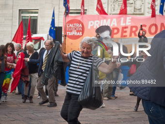 the people dance the Sirtaki music during the presentation of Italy's Tsipras List in Piazza Affari (Milan Stock Exchange) , on April 23, 20...