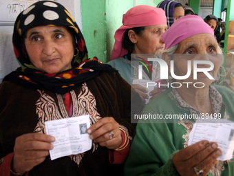 Kashmir voter showing his finger after cast the vote polling station at kokar nagh , some 70 miles south of Srinagar, on, April 24, 2014. Hu...