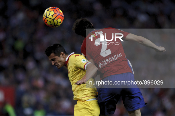 SPAIN, Madrid:Atletico de Madrid's Uruguayan Defender Diego Godin and Sporting Gijon´s Spanish Defender Luis H. during the Spanish League 20...