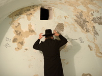 KIFL HARETH, WEST BANK - APRIL 24: An Ultra-Orthodox Jew prays inside the tomb of Nun, father of Biblical Israelite spy and leader Jehoshua...