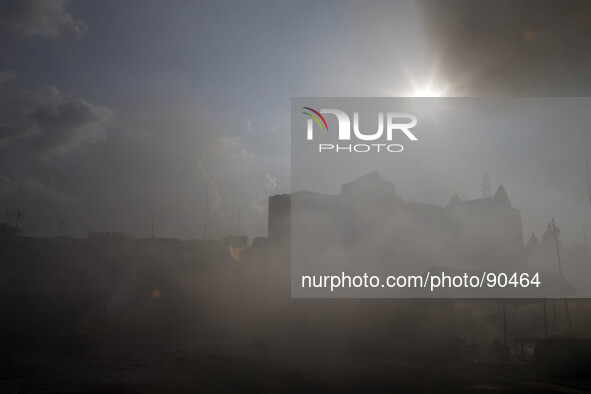 Smoke arise at the roof top of the market. The Senen Market in Central Jakarta was gutted by a fire on Friday morning. The blaze broke out a...