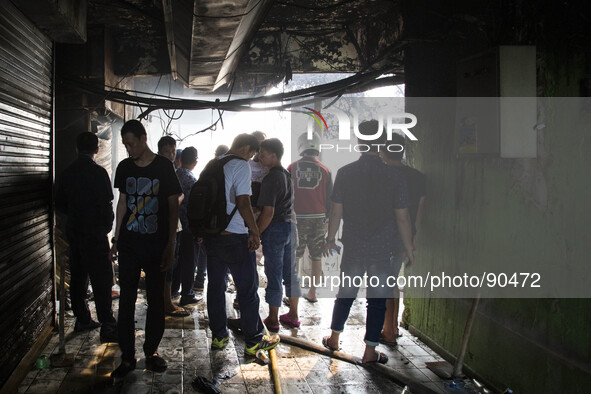 Owners of the kiosk can only watch to their burn kiosks. The Senen Market in Central Jakarta was gutted by a fire on Friday morning. The bla...