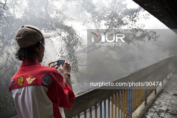 A man videoing the fire with his cell phone. The Senen Market in Central Jakarta was gutted by a fire on Friday morning. The blaze broke out...