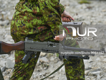 A member of the Estonian Defence League (Eesti Kaitseliit) from Tallin carries the Ksp 58 machine gun during the military competition 'Recon...