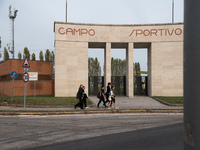 Sport field with monumental entrance and rationalist triumphal arch in Tresigallo, city rebuilt in the fascist era following a rationalist i...