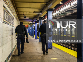 NYPD policemen are seen at subway's station at Brooklyn, New York, United States, on October 25, 2022. (