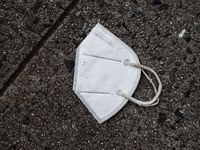 FPP2 face mask is seen laying on a street in New York, United States, on October 25, 2022. (