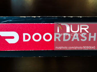 Doordash logo sign is seen in a restaurant in Chicago, United States, on October 17, 2022. (