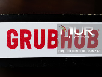Grubhub logo sign is seen in a restaurant in Chicago, United States, on October 17, 2022. (