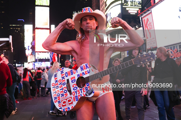 Robert John Burck, the Naked Cowboy, poses for a photo on Times Square in New York City, United States on October 22, 2022. 