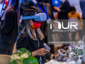 A participant to the Fintech Week tests virtual reality on the Meta stand, in Hong Kong, on November 01, 2022. (