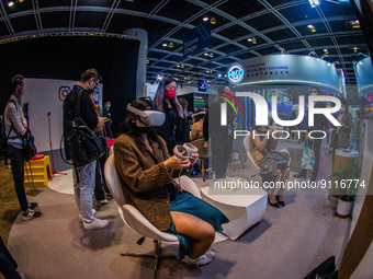 People experience the metaverse via virtual reality headsets on the stand of Meta at the Hong Kong Fintech Week,in Hong Kong, on November 01...