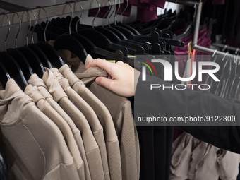 A woman is looking for clothes in a store in Athens, Greece on November 2, 2022. (