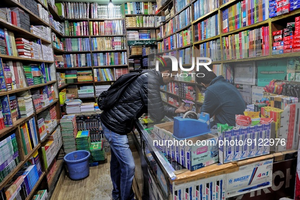 A man purchase stationery items from a book shop in Baramulla Jammu and Kashmir India on 02 November 2022 