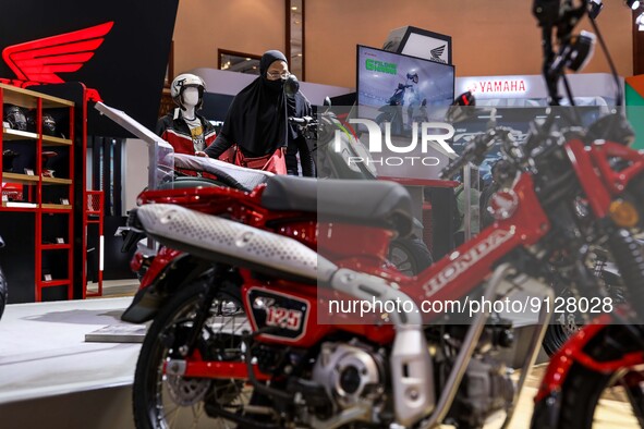 Visitors look at motorcycles during the Indonesia Motorcycle Show Exhibition in Jakarta, Indonesia, November 3, 2022. Indonesia is now makin...