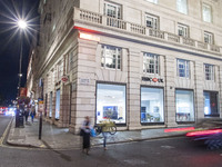 Night view of an HSBC UK - HSBC Holdings Plc Bank Branch in London with the logo bank. HSBC Holdings plc is a British multinational universa...