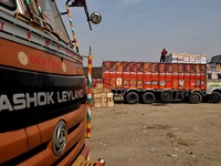 Labourers load boxes filled with apples on an Ashok Leyland truck to be sent to different fruit Markets across the country at Mustafa Memori...