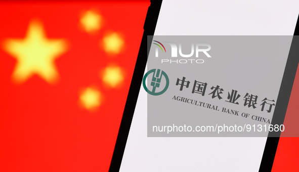 Agricultural Bank Of China logo displayed on a phone screen and Chinese flag displayed on a screen in the background are seen in this illust...
