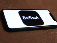 BeReal logo displayed on a phone screen is seen in this illustration photo taken in Krakow, Poland on November 5, 2022. (
